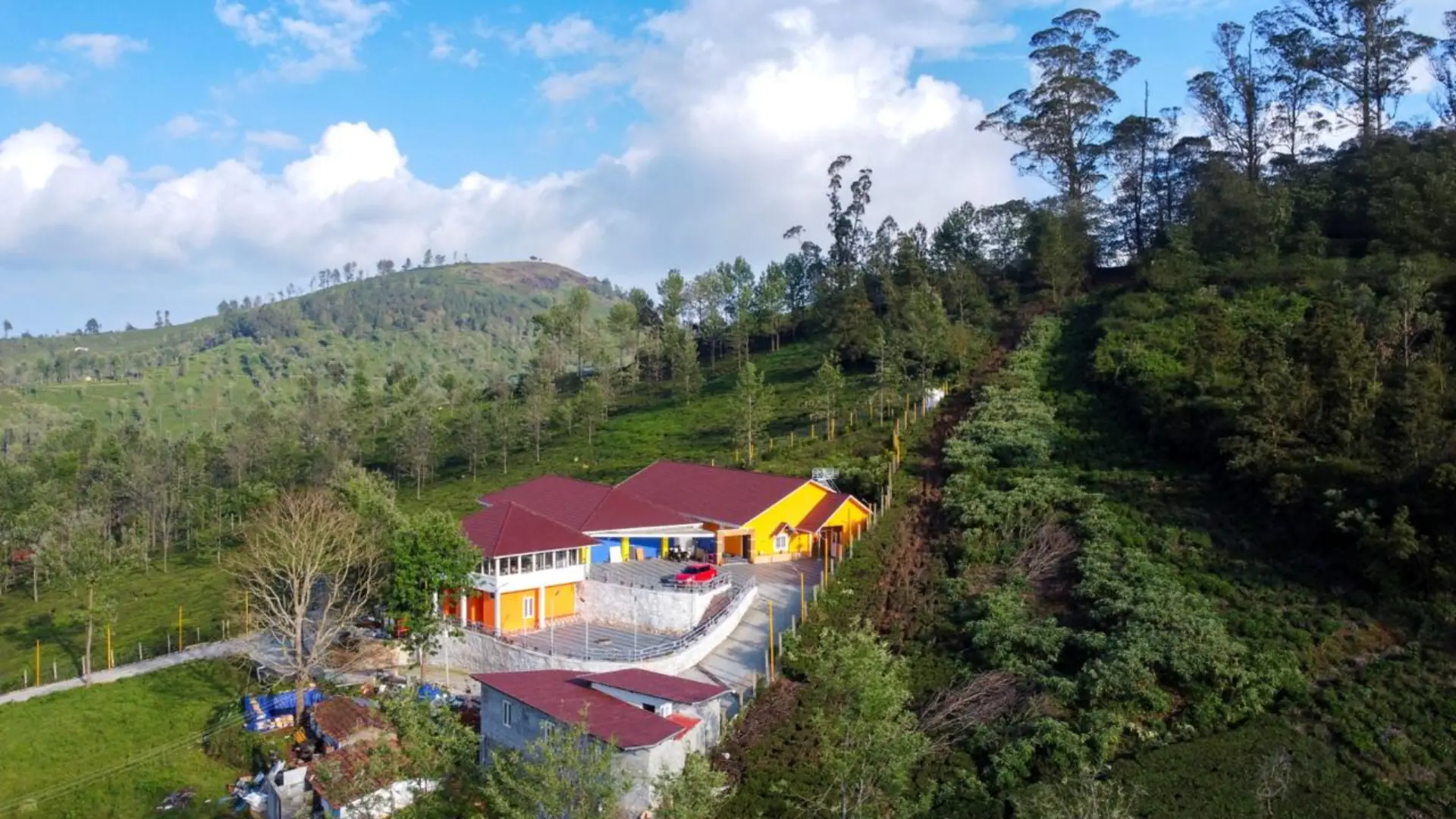 Aerial view of GM Mountain View Resort surrounded by Nilgiri hills
